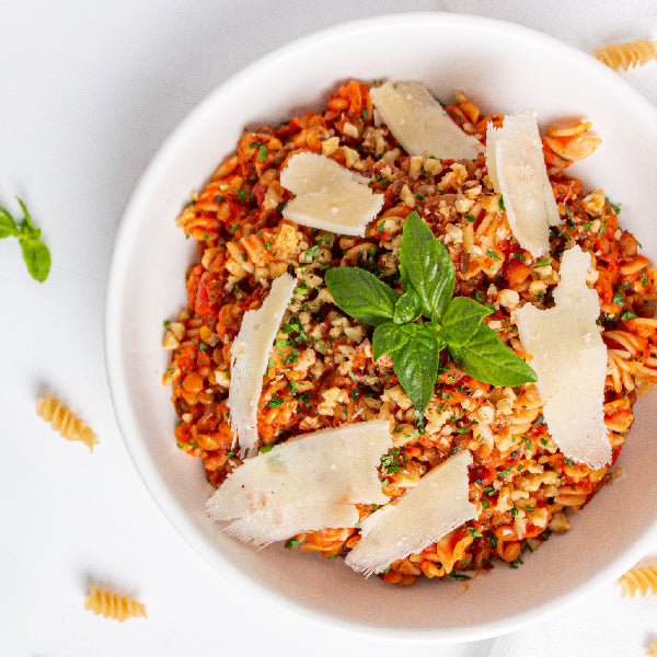 Vegan Brown Rice Fusilli with Vegan Lentil Bolognese, Arugula and Sundried Tomato Salad