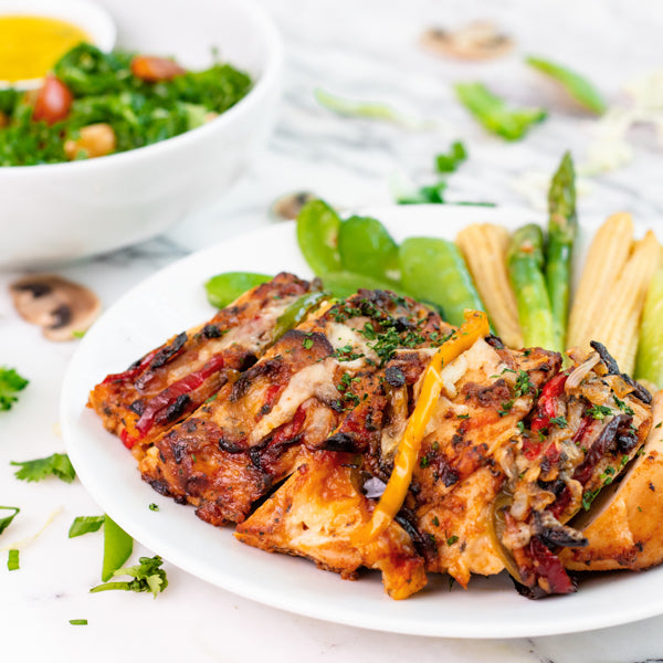 Cajun Spiced Hasselback Chicken with Peppers, Aragula and Sundried Tomato Salad