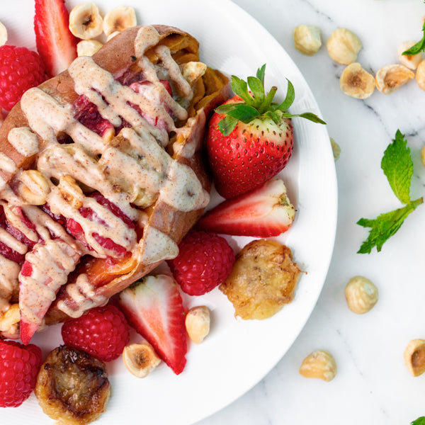 Sweet Potato Spuds with Raspberry Chia Jam, Almond Butter, Fresh Raspberries, Caramelised Bananas