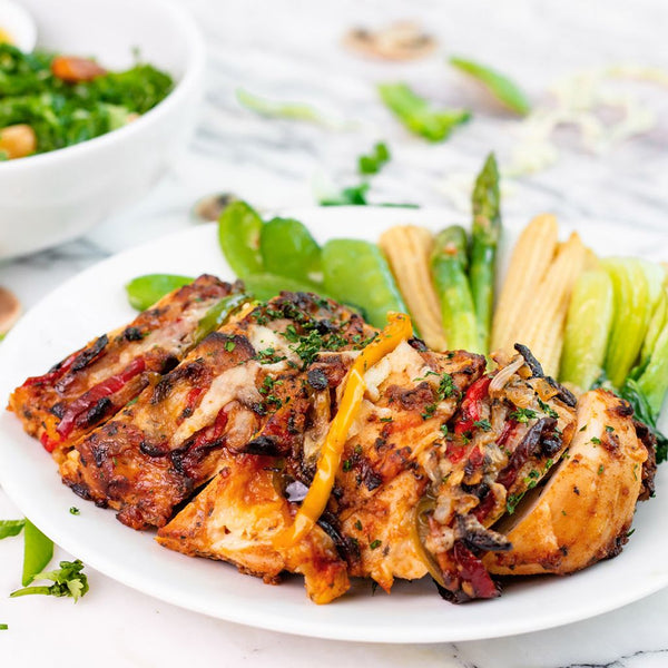 Cajun Spiced Hasselback Chicken with Peppers, Aragula Sundried Tomato Salad