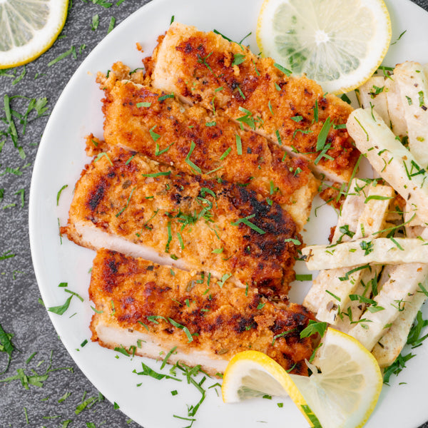 Pan fried Chicken Escalopes with Three Cabbage Slaw and Celeriac Sticks